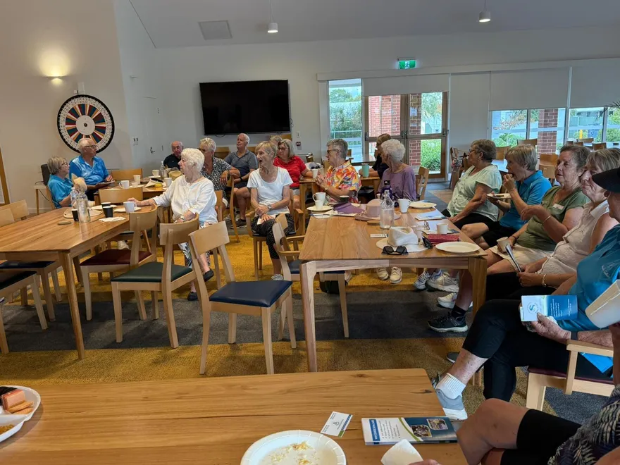 A community hall lunch with clients and support workers