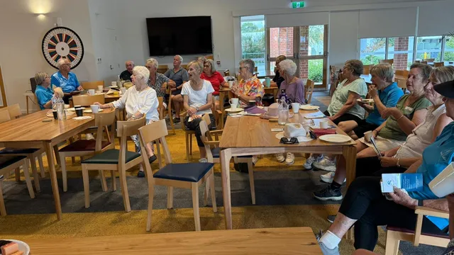 A community hall lunch with clients and support workers